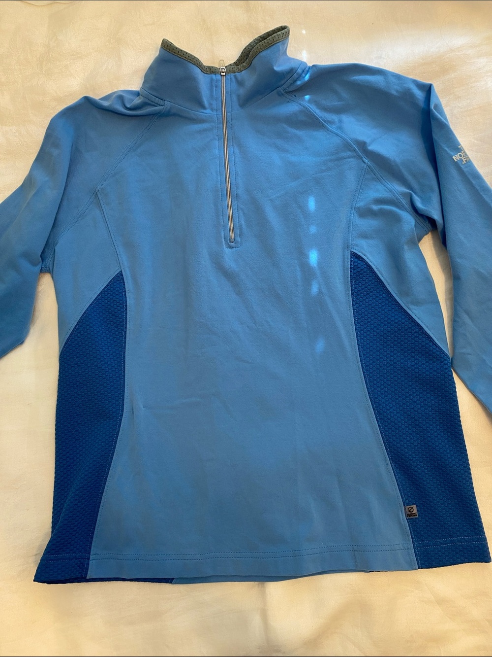 The North Face Women's Light Blue Half-Zip Pullover with Dark Blue Panels